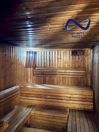 a wooden sauna with a sign on top of it at Infinity Hotel Kampala in Kampala