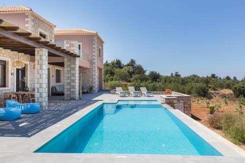 a swimming pool in the backyard of a villa at Sea View Villa Mia Casa with Private Pool, Ping-Pong & BBQ in Langá