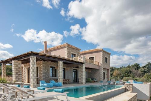 a villa with a swimming pool and a house at Sea View Villa Mia Casa with Private Pool, Ping-Pong & BBQ in Langá