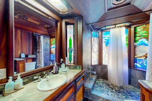 a bathroom with a sink and stained glass windows at Sierra Secret in Soda Springs