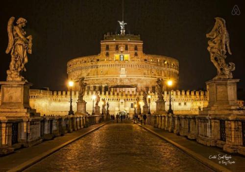 a large building is lit up at night at La Casa di Daniela in Lido di Ostia