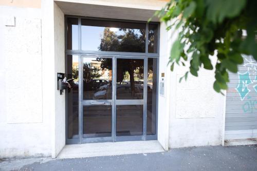 an open glass door of a building at La Casa di Daniela in Lido di Ostia