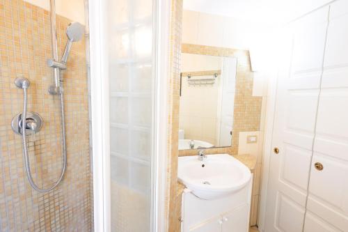 a bathroom with a shower and a sink at La Casa di Daniela in Lido di Ostia