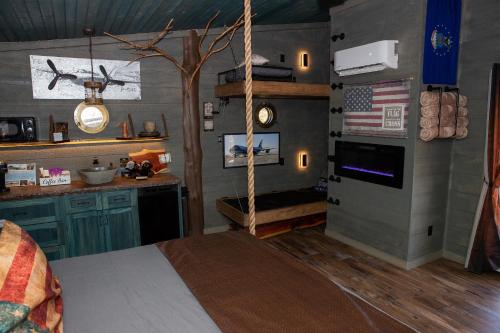 a bedroom with an american flag on the wall at "Air Fort One" Aviation-Themed Luxury Treehouse Near Dollywood & Pigeon Forge in Sevierville