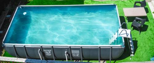 a swimming pool in the middle of a yard at Dom Adonis in Dilijan
