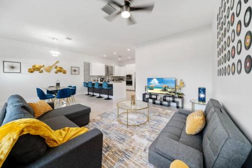 a living room with a couch and a table at Modern RocknHome Near Hard Rock and FLL Airport in Fort Lauderdale