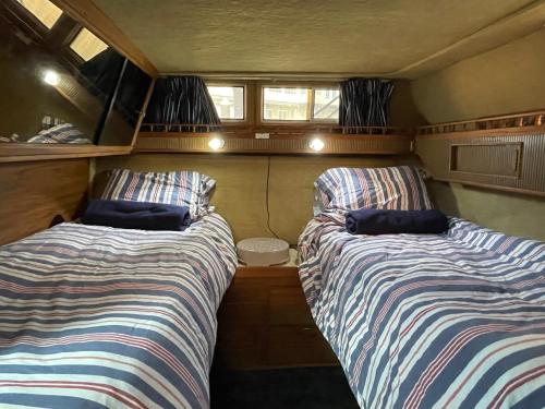 two beds in the back of an rv at Private Yacht in San Francisco in San Francisco