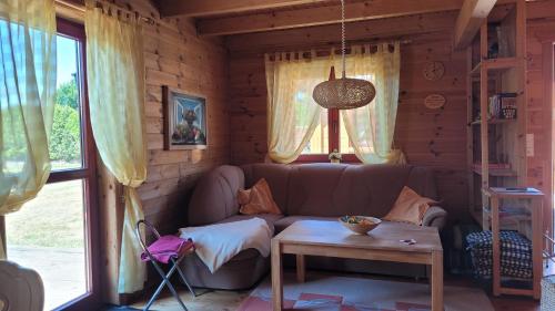 a living room with a couch and a table at Ferienhaus Bliev-Hee Nr 2 in Klink