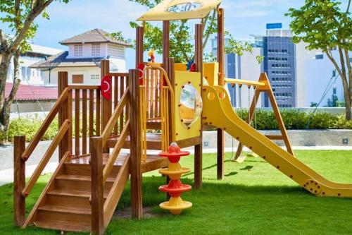 a playground with a slide in a park at Sea View 2 Bed Room Condo @ Central Pattaya in Pattaya Central