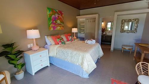 Una cama o camas en una habitación de Suite La Orquidea