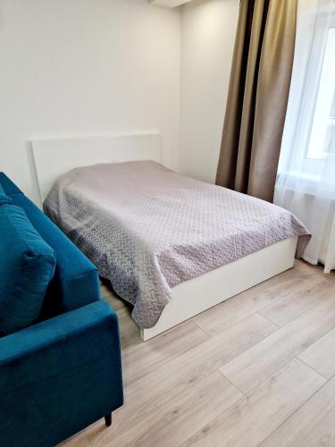 En eller flere senge i et værelse på Apartments in Lazdijai