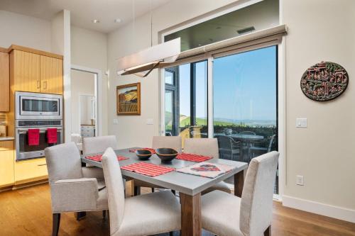 a kitchen and dining room with a table and chairs at Trellis at Baptista Maresh Vineyard in Dundee