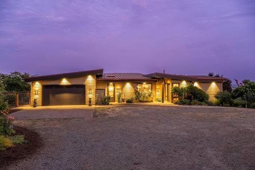 a house with lights on the front of it at Trellis at Baptista Maresh Vineyard in Dundee