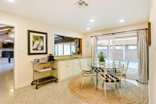 a kitchen and dining room with a table and chairs at Indoor Pool Peaceful Oasis in Hitchcock! in Hitchcock