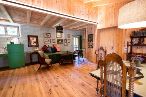 a living room with a couch and a table at Haus Himmelfahrt in Soprabolzano