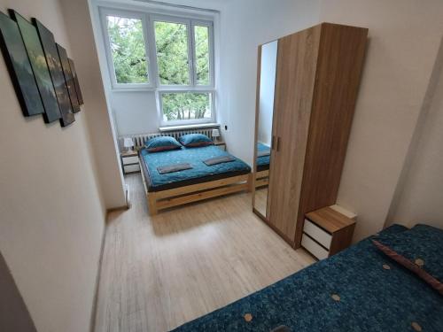 Postel nebo postele na pokoji v ubytování VasylOk