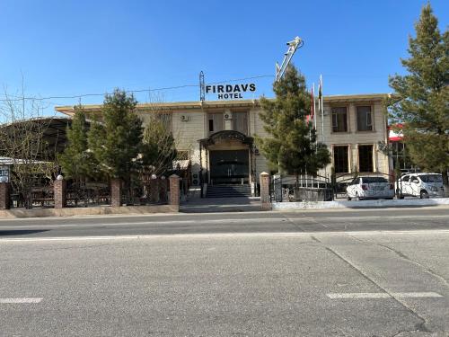 a building with a sign that reads fire hydrants motel at FIRDAVS HOTEL in Navoi