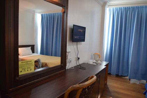 Кровать или кровати в номере Hotel Sri Garden Sdn. Bhd.