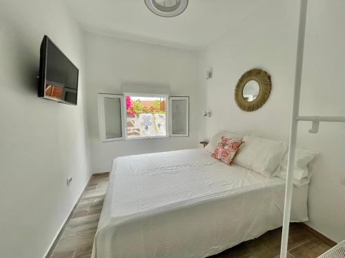 Кровать или кровати в номере Eden Gomera Suites