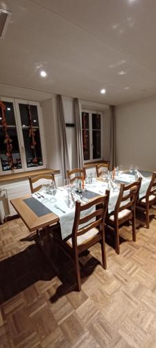 a group of tables and chairs in a room at Hotel / Restaurant Post in Eschlikon