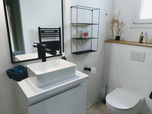 Et badeværelse på Superbe appartement de standing Le Trophée du Golf