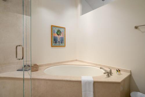a bathroom with a bath tub and a shower at The Porches in Steamboat Springs