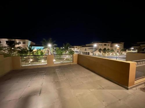 a view of a balcony at night with lights at Alwaha luxury Villa 5 Bedrooms فيلا الواحه in King Abdullah Economic City