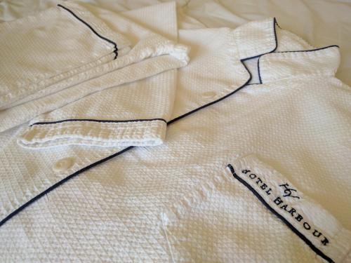a close up of a white shirt on a bed at Hotel Harbour Yokosuka - Vacation STAY 73906v in Yokosuka