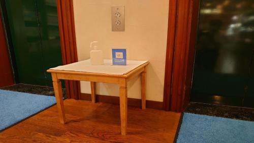 a small table with a bottle of soap on it at Hotel Harbour Yokosuka - Vacation STAY 73906v in Yokosuka