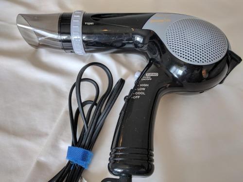 a blow dryer and a microphone on a sheet at Hotel Harbour Yokosuka - Vacation STAY 73906v in Yokosuka