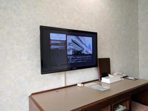 a flat screen tv sitting on top of a table at Hotel Harbour Yokosuka - Vacation STAY 83183v in Yokosuka