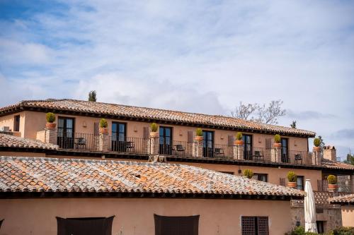 a building with balconies and a roof at Cigarral de Caravantes in Toledo
