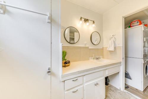 a bathroom with a sink and a refrigerator at Cloudcroft Vacation Rental about 1 Mi to Downtown! in Cloudcroft