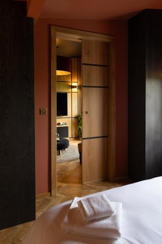 a bedroom with a door leading into a room at The Black Cabin Oban in Oban