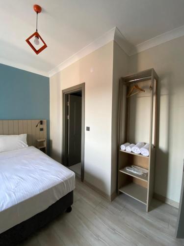 a bedroom with a bed and a closet at Vera Edirne in Edirne
