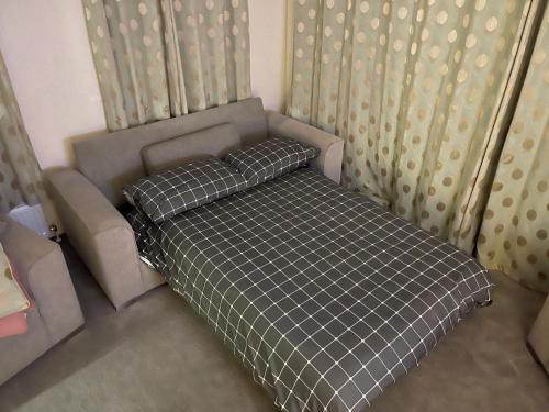 A bed or beds in a room at Lake District Luxury Lodge