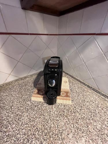 a cell phone sitting on a counter in a bathroom at Tenuta Poggio alla Farnia in Fauglia
