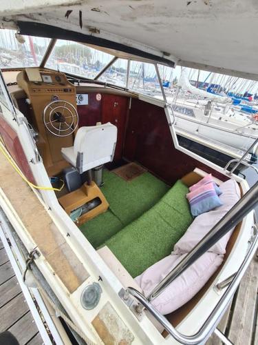 an inside view of a boat with a green floor at Bateau in Ouistreham