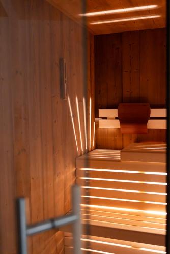 a sauna with wooden walls and a wooden floor at Haus Himmelfahrt in Soprabolzano