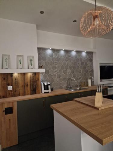 a kitchen with a sink and a counter top at Apartment Emilia in Świdnica