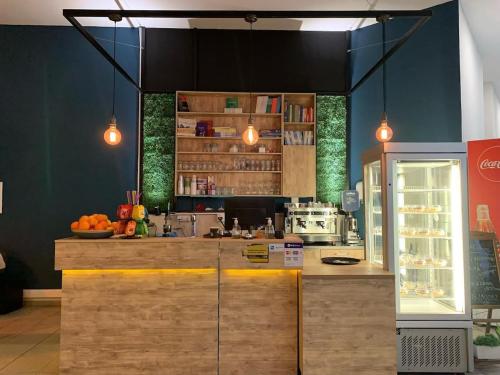 a kitchen with a counter in a store at Skyline Retreat Apartment at Sky Towers with Spa and Fitness Access in Skopje