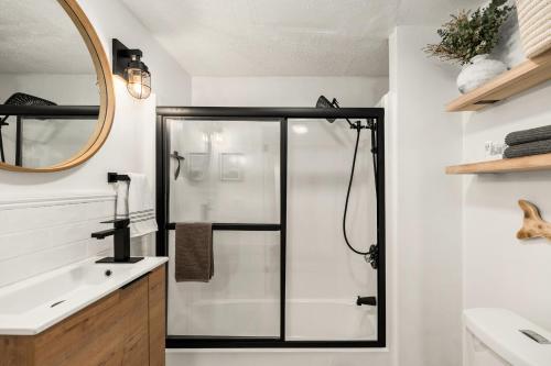 a bathroom with a shower and a sink at A by the Bay - Stunning Seaside Apartment in Gloucester