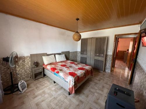 a bedroom with a bed and a fan in it at Casa VIRAMAR in Barra del Chuy