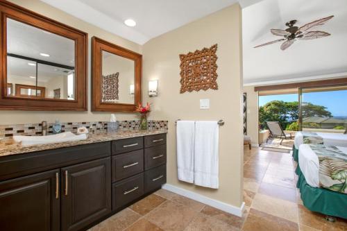 a bathroom with a sink and a mirror at K B M Resorts- KGV-25P6 Breathtaking 2Bd remodeled villa, ocean and golf fairway views in Kapalua
