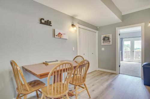 a dining room with a table and chairs at Luxe Midway Condo with Golf Course and Mountain Views! in Midway
