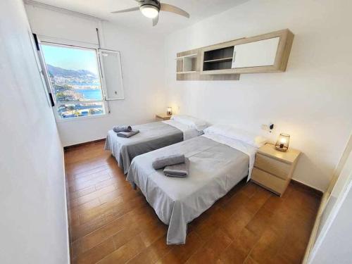 Giường trong phòng chung tại Europa Beach House Vistas panorámicas al mar