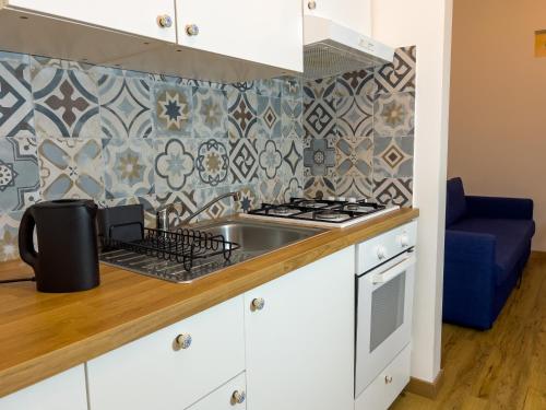 Η κουζίνα ή μικρή κουζίνα στο Incanto Apartment