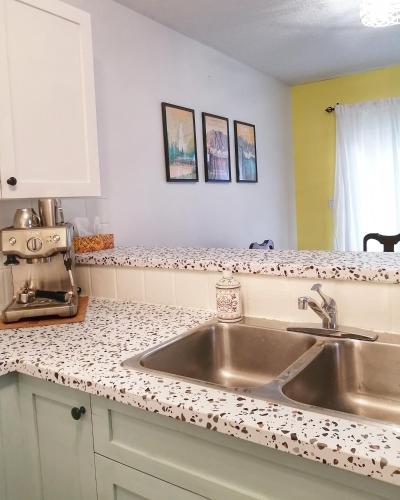 a kitchen with a sink and a counter top at Bright 3 bed 3 bath House in Radium Hot Springs in Radium Hot Springs