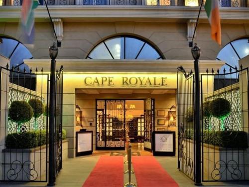 a large building with a gate in front of a store at Cape Royale from McStay in Cape Town