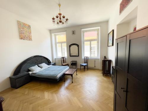 a living room with a bed and a table at Center of Prague Apartment 369 in Prague